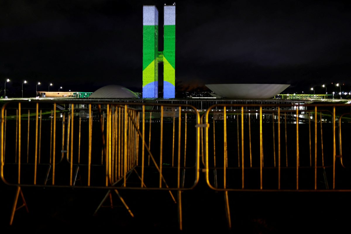 Brazil’s flag is projected on the building of the National Congress as part of events to mark the consolidation of democracy in Brazil, a year after supporters of far-right former president Jair Bolsonaro stormed the presidential palace, Congress and Supreme Court on January 8, 2023, in Brasilia, Brazil January 7, 2024. REUTERS/Ueslei Marcelino/ File Photo