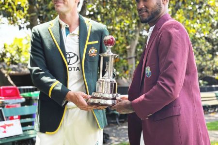 Kraigg Brathwaite (right) and Pat Cummins with the Frank Worrell Trophy yesterday. The first Test bowls off at the Adelaide Oval  tonight, 7:30 pm, Eastern Caribbean time. (Windies Cricket photo)