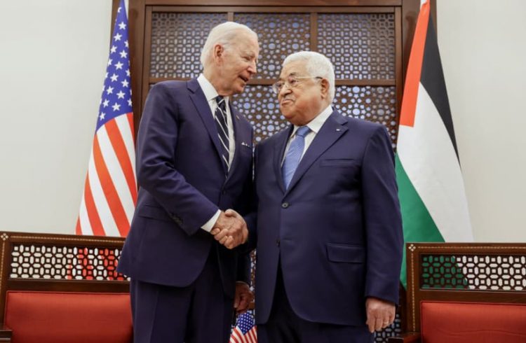 US President Joe Biden shakes hands with Palestinian President Mahmoud Abbas at the Presidential Compound, in Bethlehem, in the West Bank July 15, 2022(photo credit: REUTERS/EVELYN HOCKSTEIN)