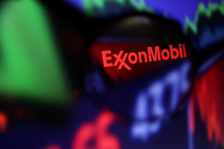 FILE PHOTO: Exxon Mobil logo and stock graph are seen through a magnifier displayed in this illustration taken September 4, 2022. REUTERS/Dado Ruvic/Illustration/File Photo