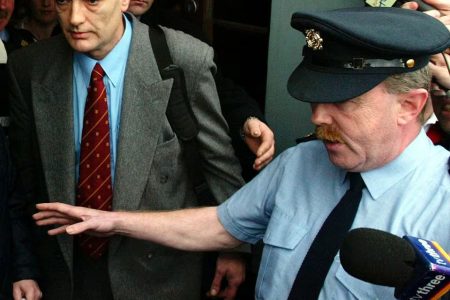 Ian Bailey leaves Cork Circuit Court in Ireland surrounded by police and media, January 19, 2004. (Reuters photo)