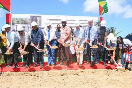 President Irfaan Ali, sixth from right, along with other officials are seen about to turn the sod for the spanking new New Amsterdam Hospital. (DPI photo)
