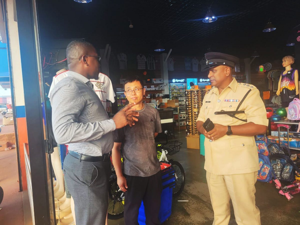 The police in discussion with a business owner (Police photo)