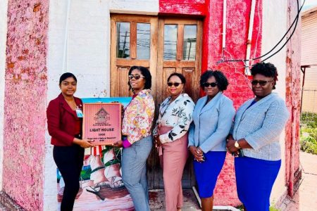 The Georgetown Lighthouse is now a national monument. A plaque signifying this was presented to Louise Williams (second from left), Director of Ports and Harbours at the Maritime Administration Department (MARAD), by Hemandri Ramautar of the National Trust of Guyana, Ministry of Culture, Youth and Sport. The Department of Public Information (DPI) said yesterday that Williams expressed her gratitude on behalf of MARAD for the recognition bestowed by the National Trust of Guyana. (DPI photo)