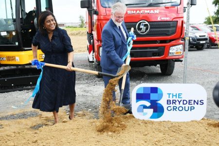 Trade and Industry Minister Paula Gopee-Scoon, left, and Brydens Group deputy chairman, Michael Conyers turn the sod to start the construction of its US$29 million distribution centre, on Factory Road, Chaguanas, Friday.