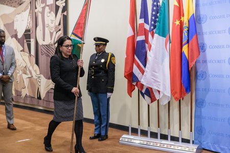 Permanent Representative of Guyana to the United Nations, Ambassador Carolyn Rodrigues-Birkett conveying Guyana’s flag to stand with those of other Security Council members outside the Council chambers. (Photo from Guyana’s mission to the UN)
