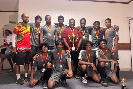 The victorious Saints S Team pose with their spoils.