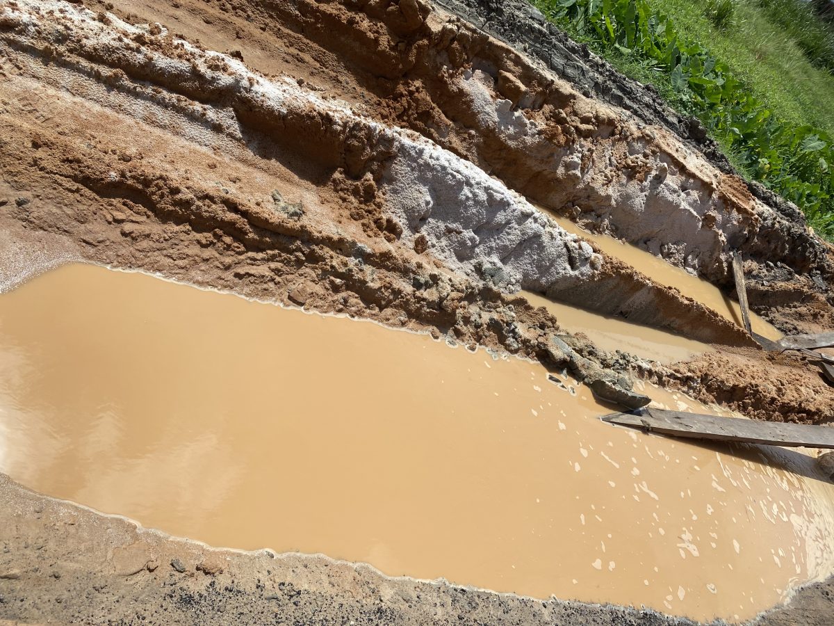 A sunken part of the roadway
