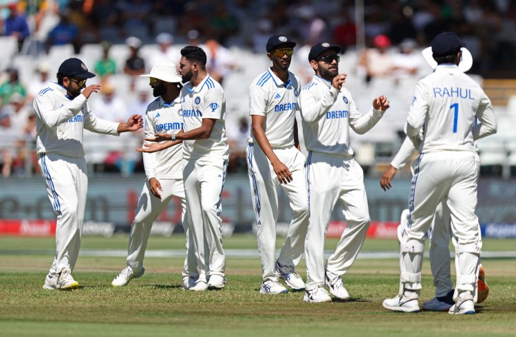 Cricket - Second Test - South Africa v India - Newlands Cricket Ground, Cape Town, South Africa - January 3, 2024 India's Mohammed Siraj celebrates with teammates after taking the wicket of South Africa's Aiden Markram, caught out by Yashasvi Jaiswal REUTERS/Esa Alexander