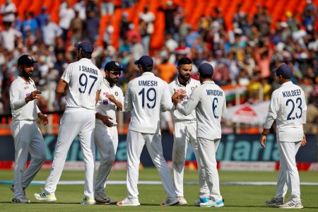 Fourth Test - Narendra Modi Stadium, Ahmedabad, India - March 6, 2021. India's captain Virat Kohli and his teammates congratulate each other after they beat England. REUTERS/Amit Dave/File Photo
