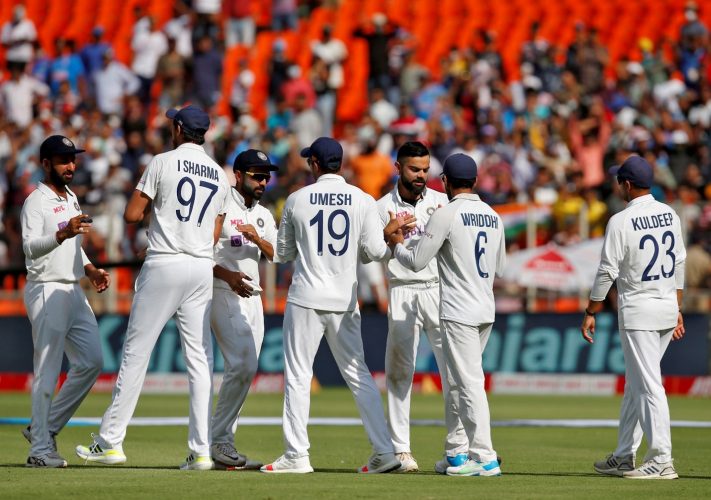 Fourth Test - Narendra Modi Stadium, Ahmedabad, India - March 6, 2021. India's captain Virat Kohli and his teammates congratulate each other after they beat England. REUTERS/Amit Dave/File Photo
