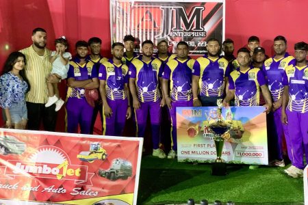 The victorious Cotton Tree outfit is posing with their spoils after retaining the AJM T20 Cricket Championship.