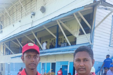 Berbice U15 all-rounder Gibran Yacoob (left) receiving a cricket bat from Vicky Bharosay, a representative of the Cricket Gear for Young and Promising Cricketers in Guyana’ project
