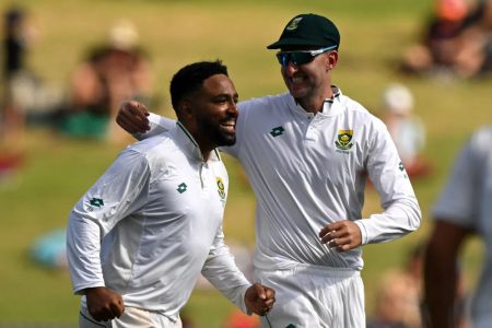 Dane Piedt (left) recorded his career best Test figures of 5-89 to help South Africa dismiss hosts New Zealand for 211