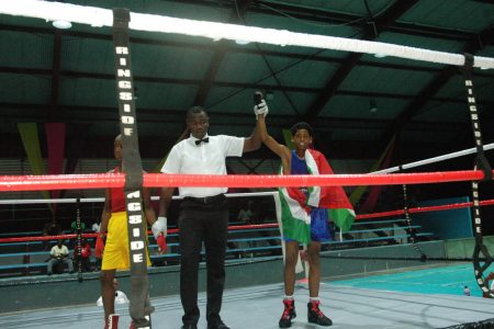 Donn Sadhoe of Suriname is officially declared the winner against Joshua Lewis of Guyana.