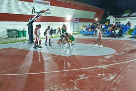 A scene from the Eagles and UG Trojans conference semi-final in the ‘One Guyana’ Basketball League