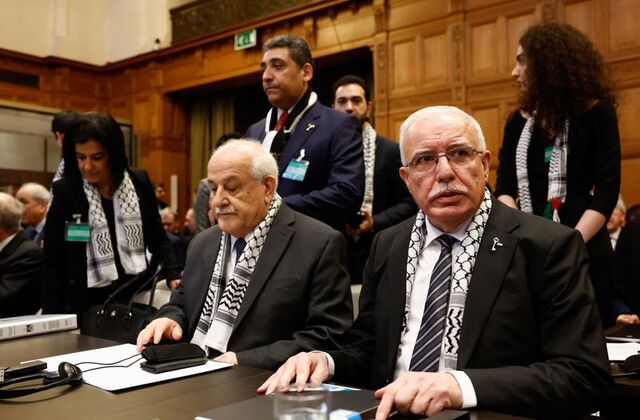 Palestinian Foreign Minister Riyad al-Maliki and Palestinian U.N. envoy Riyad Mansour attend a public hearing held by The International Court of Justice (ICJ) to allow parties to give their views on the legal consequences of Israel's occupation of the Palestinian territories before eventually issuing a non-binding legal opinion in The Hague, Netherlands, February 19, 2024. REUTERS/Piroschka van de Wouw