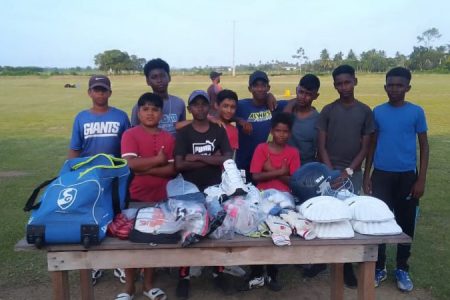 Several Leguan youth cricketers posing with the recently donated equipment compliments of the ‘Cricket Gear for Young and Promising Cricketers in Guyana’
