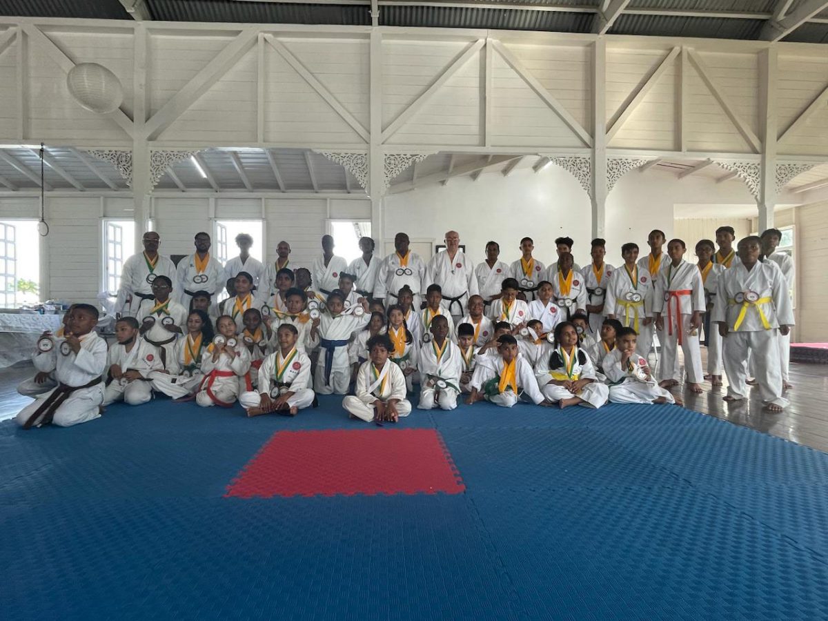 The participants pose with their respective spoils
following the conclusion of the Guyana Shotokan Karate Championships at the YMCA Dojo, Thomas Lands.