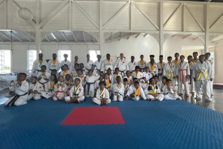 The participants pose with their respective spoils
following the conclusion of the Guyana Shotokan Karate Championships at the YMCA Dojo, Thomas Lands.
