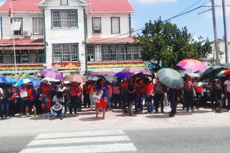 Teachers standing in solidarity on day 16 in front of the Ministry of Education on Brickdam
