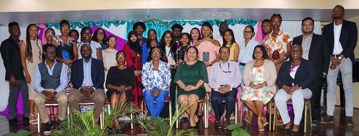 Vice-Chancellor Professor Paloma Mohamed Martin, (4th from right, front row), Dean of FEES Linda Johnson-Bhola (5th right), and other members of the faculty pose with the awardees