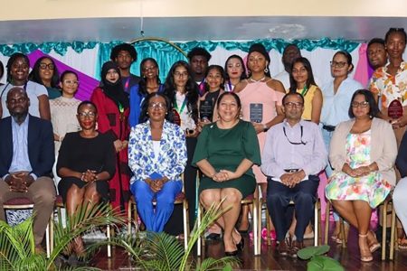 Vice-Chancellor Professor Paloma Mohamed Martin, (4th from right, front row), Dean of FEES Linda Johnson-Bhola (5th right), and other members of the faculty pose with the awardees