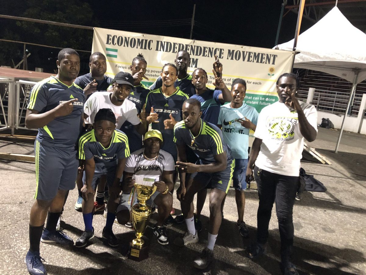 The victorious Stabroek Ballers outfit posing with their spoils
