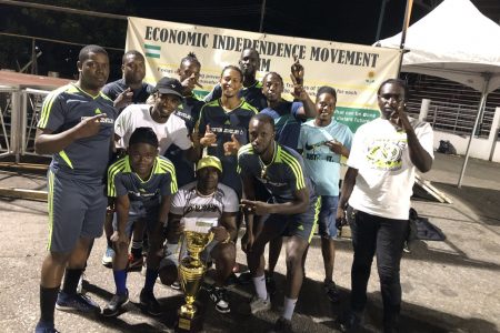 The victorious Stabroek Ballers outfit posing with their spoils
