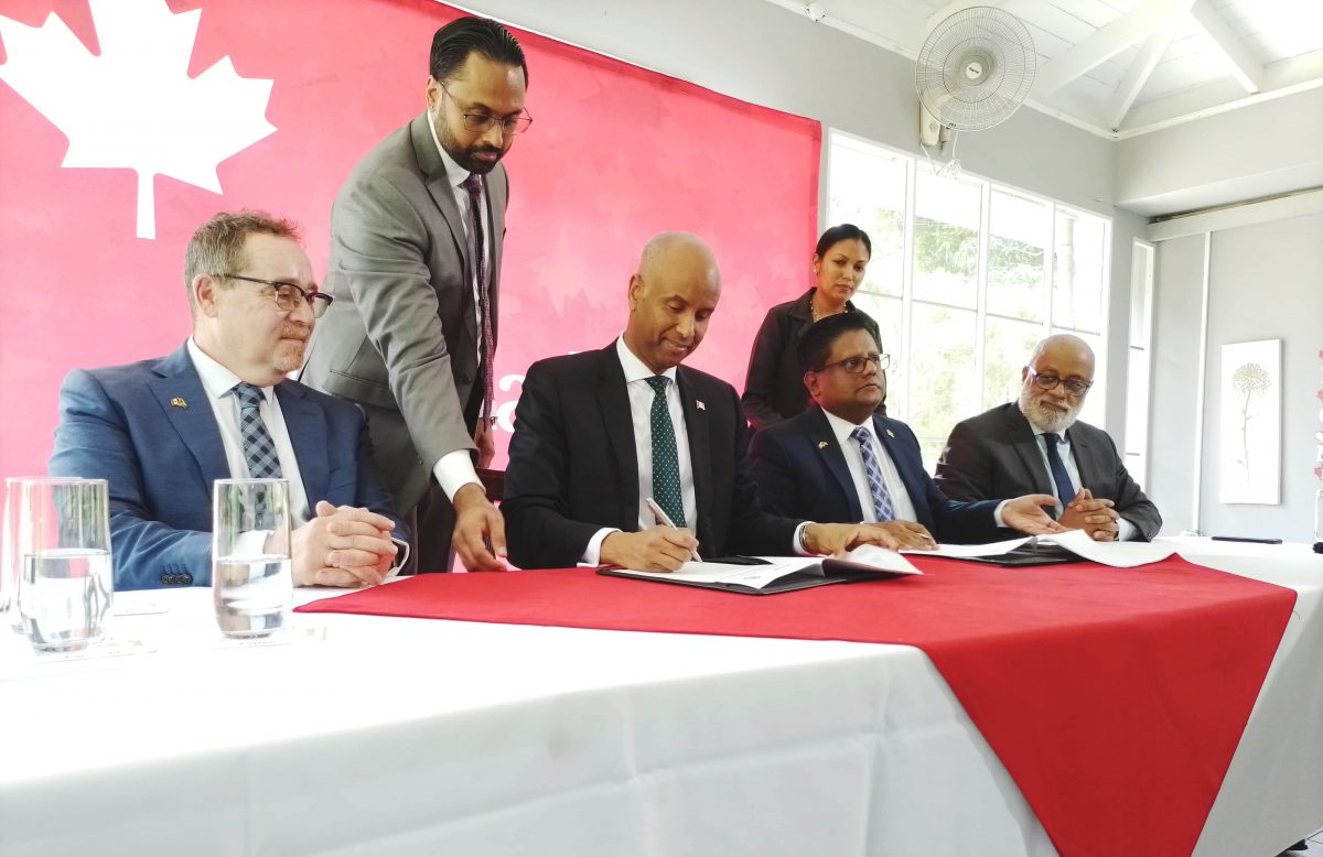 Seated from left: Canadian High Commissioner to Guyana Mark Berman, Canadian Minister of International Development Ahmed Hussen, and Minister of Finance Dr Ashni Singh and Anton Edwards General Manager at the IDB’s Caribbean Country Department at the signing of the sovereign loan agreement (Antonio Dey)
