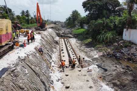 Construction has commenced on the remaining section of the Eccles Access Road (Dump Site Road). The road is being converted into a four-lane thoroughfare to connect Heroes Highway to the East Bank four-lane Highway (Public Road). (Central Housing and Planning Authority photo)