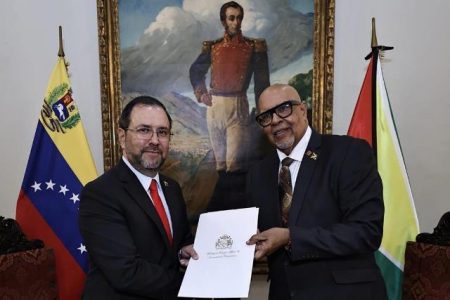 Dr. Richard Van West-Charles (right) presenting his letters of credence to Yvan Gil, Minister for People’s Power for Foreign Affairs of the Bolivarian Republic of Venezuela (Ministry of Foreign Affairs photo)