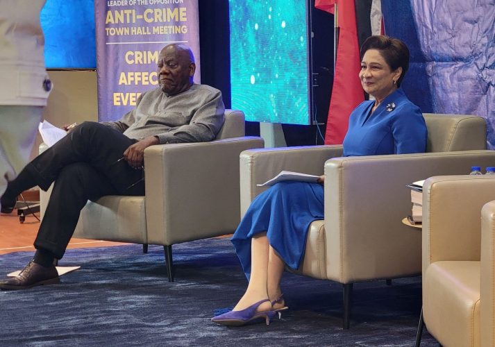 UNC leader Kamla Persad Bissessar (right) and Professor Selwyn Cudjoe at the UNC’s Anti-Crime Town Hal Meeting at the Chaguanas Borough Corporation on Monday night. (UNC Facebook)