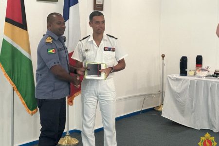 French Navy Captain  Laurent Martin (right)  with Commanding Officer of the Coast Guard, Commander David Shamshudeen  (GDF photo)