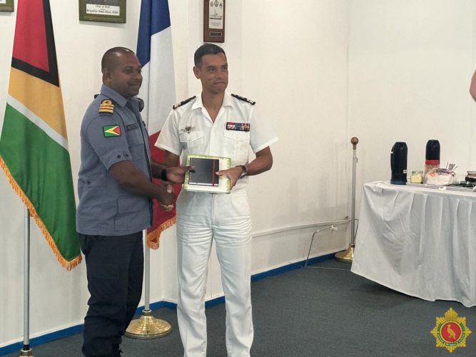 French Navy Captain  Laurent Martin (right)  with Commanding Officer of the Coast Guard, Commander David Shamshudeen  (GDF photo)