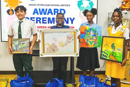From left are: Michael Jardine (first place), Rachard Collymore (second place), Rohamaya Jawanz (third place) and honorary winner Lennicea Waldron with their entries.