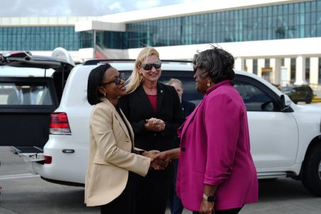Linda Thomas-Greenfield (right) being welcomed by Minister of Tourism, Industry and Commerce, Oneidge Walrond. US Ambassador Nicole Theriot is at centre. (US Embassy photo)
