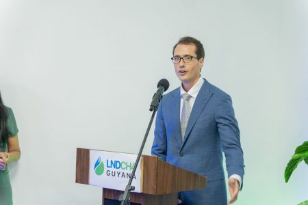 An official of LNDCH4 Guyana speaking at the opening (Office of the Prime Minister photo) 