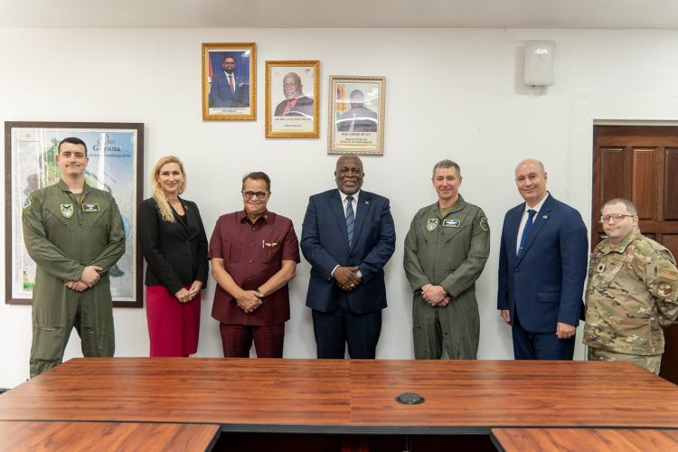 Prime Minister Mark Phillips (centre) with Major General Evan Pettus (third from right), US Ambassador to Guyana Nicole Theriot (second from left) and National Security Advisor  Gerry Gouveia (third from left). (Office of the Prime Minister photo)