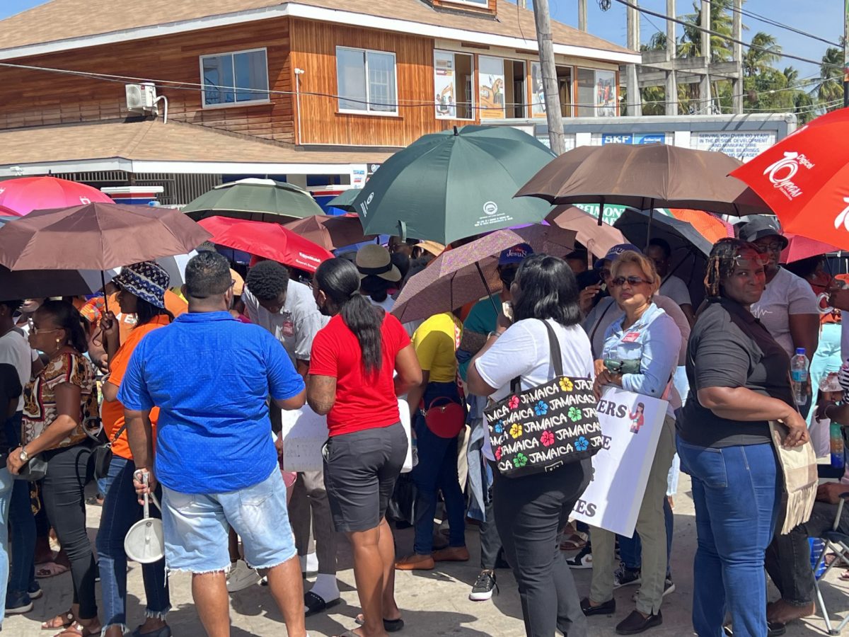 Teachers on strike protesting along the Port Mourant, Corentyne Public Road yesterday a stone’s throw away from where President Irfaan Ali was commissioning the first phase of the Guyana Technical Training College Inc. 