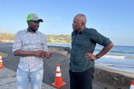 Sherod Duncan (right) with the Chief Secretary of Tobago, Farley Augustine at one of the sites contaminated by the spill