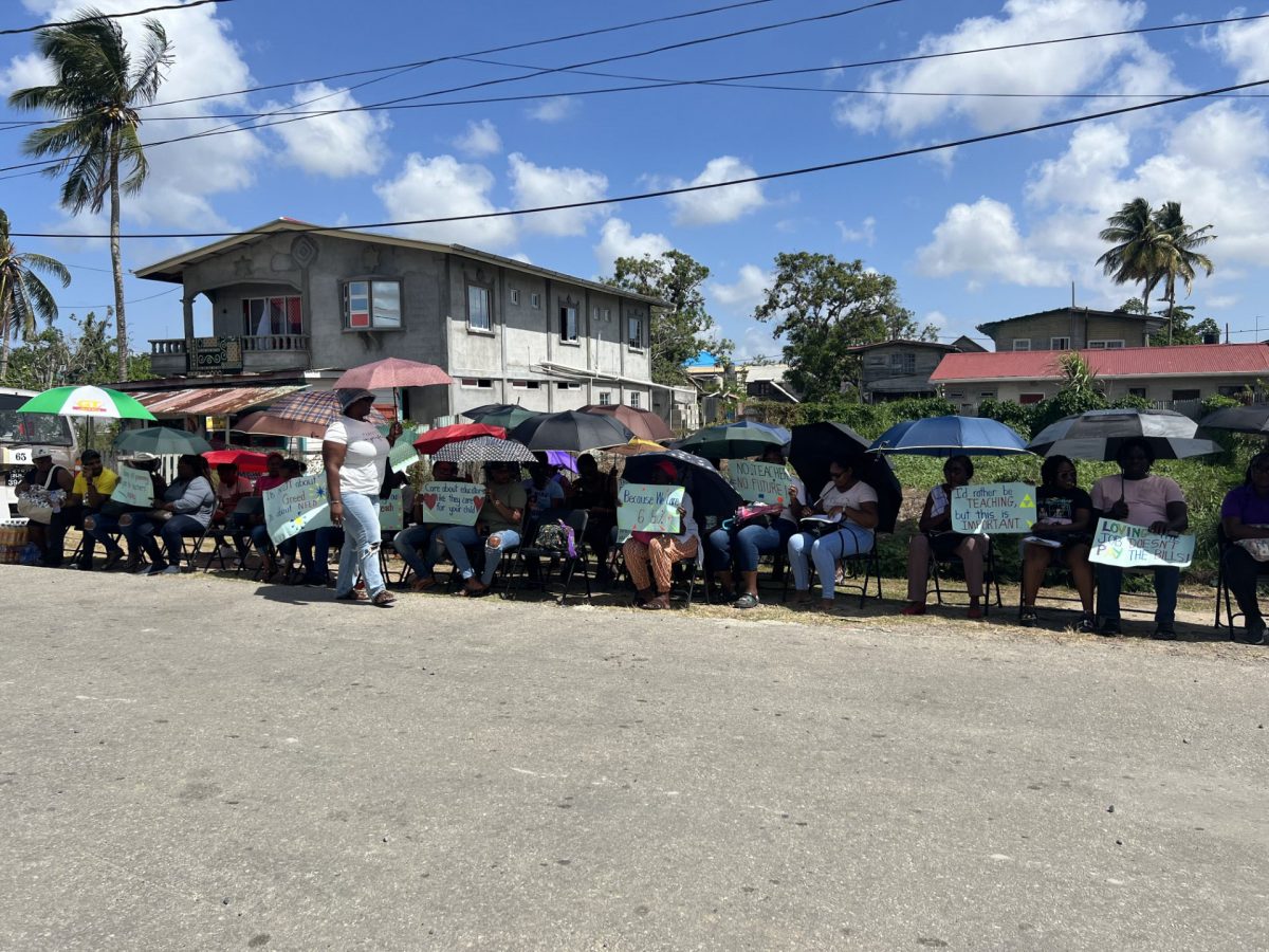 Teachers protesting in front of the Regional Education Department in New Amsterdam yesterday. 