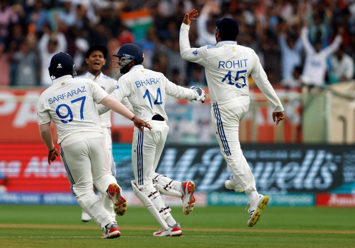 India’s Rohit Sharma celebrates with Srikar Bharat and Sarfaraz Khan after taking the catch to dismiss England’s Ollie Pope, off the bowling of Ravichandran Ashwin REUTERS/Francis Mascarenhas