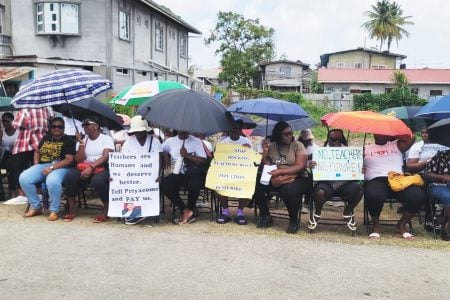 Teachers protesting yesterday  in front of the Regional Education Department located in New Amsterdam. 