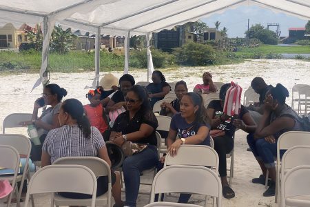 Some of the teachers under a tent
