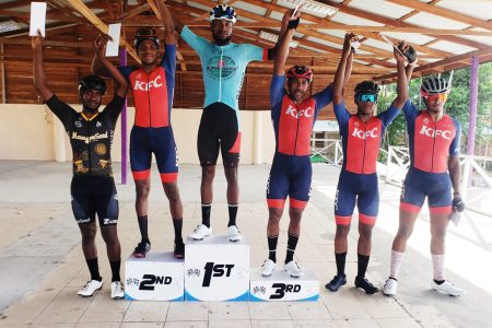 Winner of the Forbes Burnham Memorial Cycling Road Race, Britton John (centre) poses alongside the top six finishers from left: Mario Washington (fourth), Curtis Dey (2nd), Robin Persaud (third), Aaron 