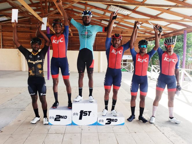 Winner of the Forbes Burnham Memorial Cycling Road Race, Britton John (centre) poses alongside the top six finishers from left: Mario Washington (fourth), Curtis Dey (2nd), Robin Persaud (third), Aaron 