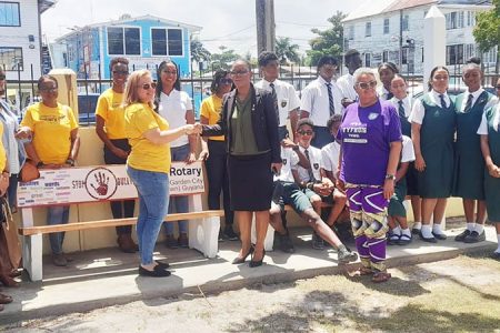 Members of the Rotary Club of Garden City Georgetown, students and teachers at the installation at the Bishops’ High School