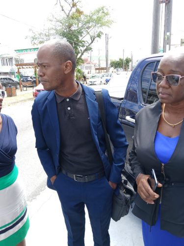 Christopher Thompson speaking to the press yesterday outside the office of GPSCCUL (Antonio Dey photo) 