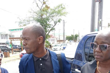Christopher Thompson speaking to the press yesterday outside the office of GPSCCUL (Antonio Dey photo) 